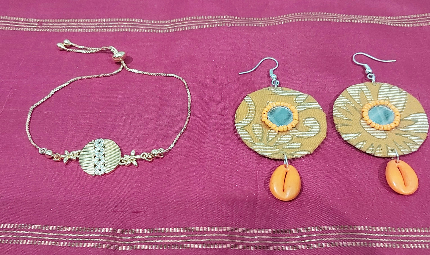 AD stone gold adjustable bracelet  with handcrafted fabric orange shell earring